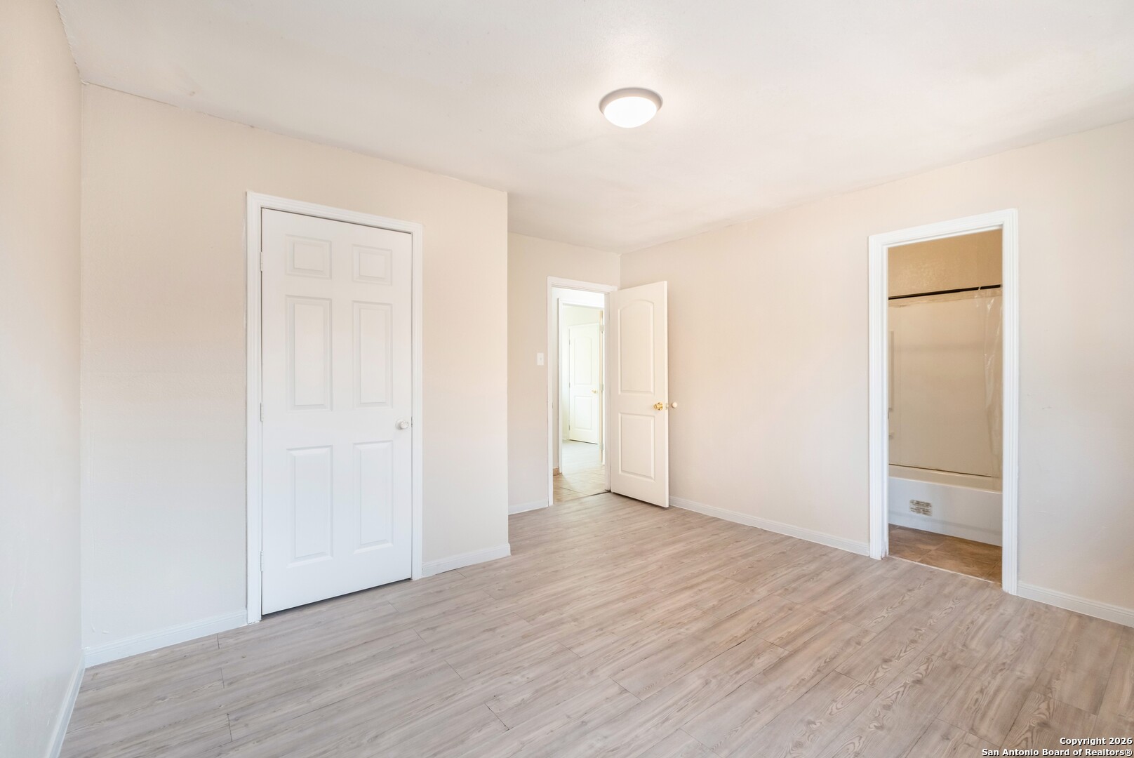 5207 Overpool Street San Antonio, TX 78228 - Photo 15 of 31 a view of an empty room with wooden floor