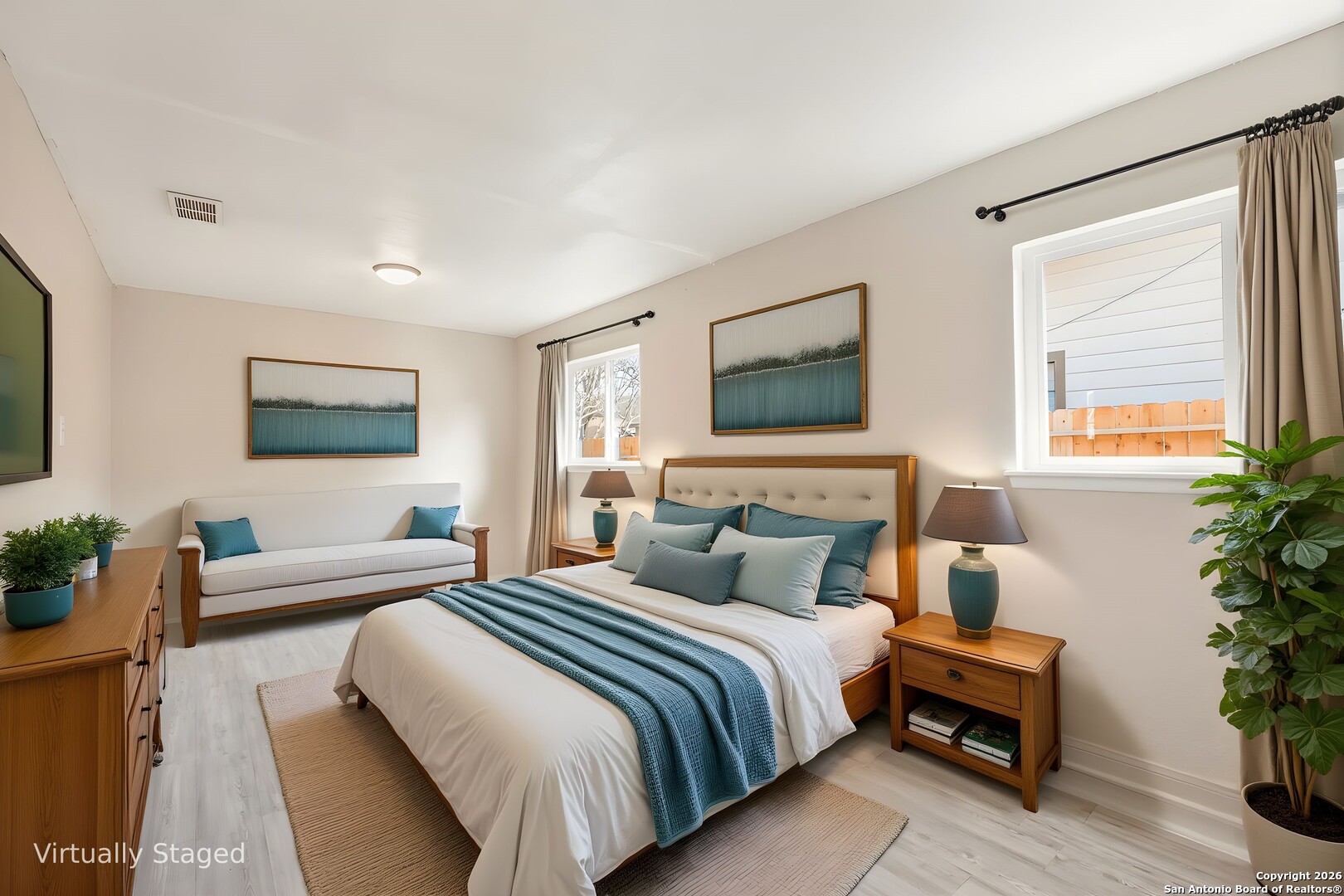 5207 Overpool Street San Antonio, TX 78228 - Photo 18 of 31 a bedroom with a large bed and a couch