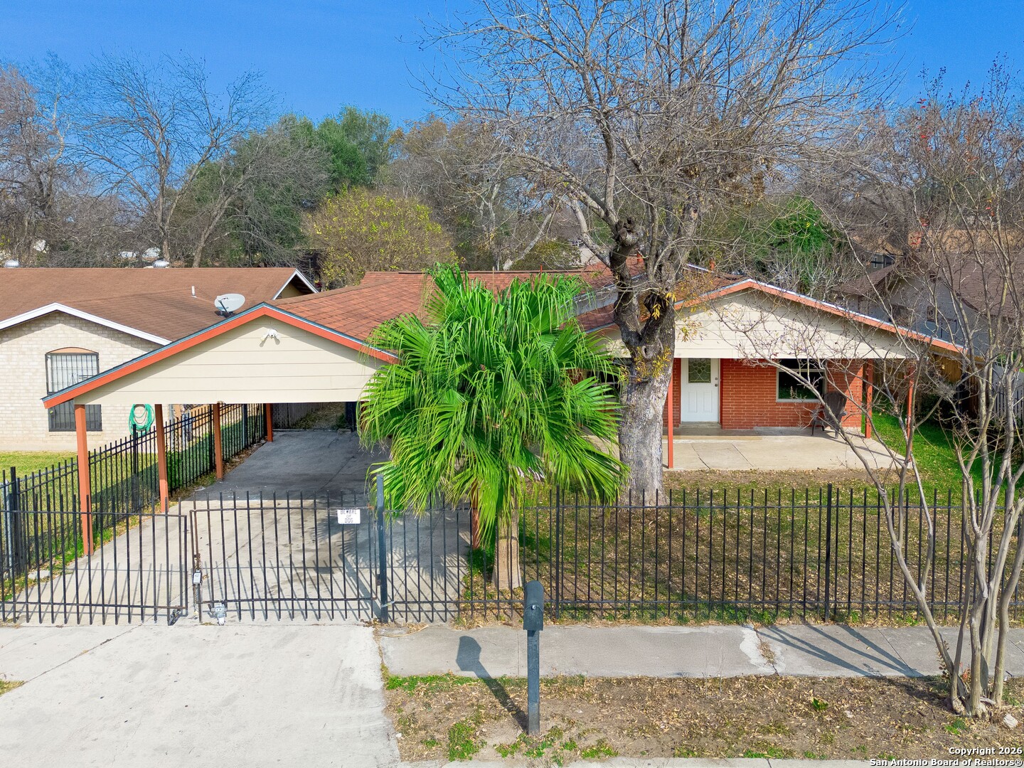 5207 Overpool Street San Antonio, TX 78228 - Photo 2 of 31 a front view of a house with a garden