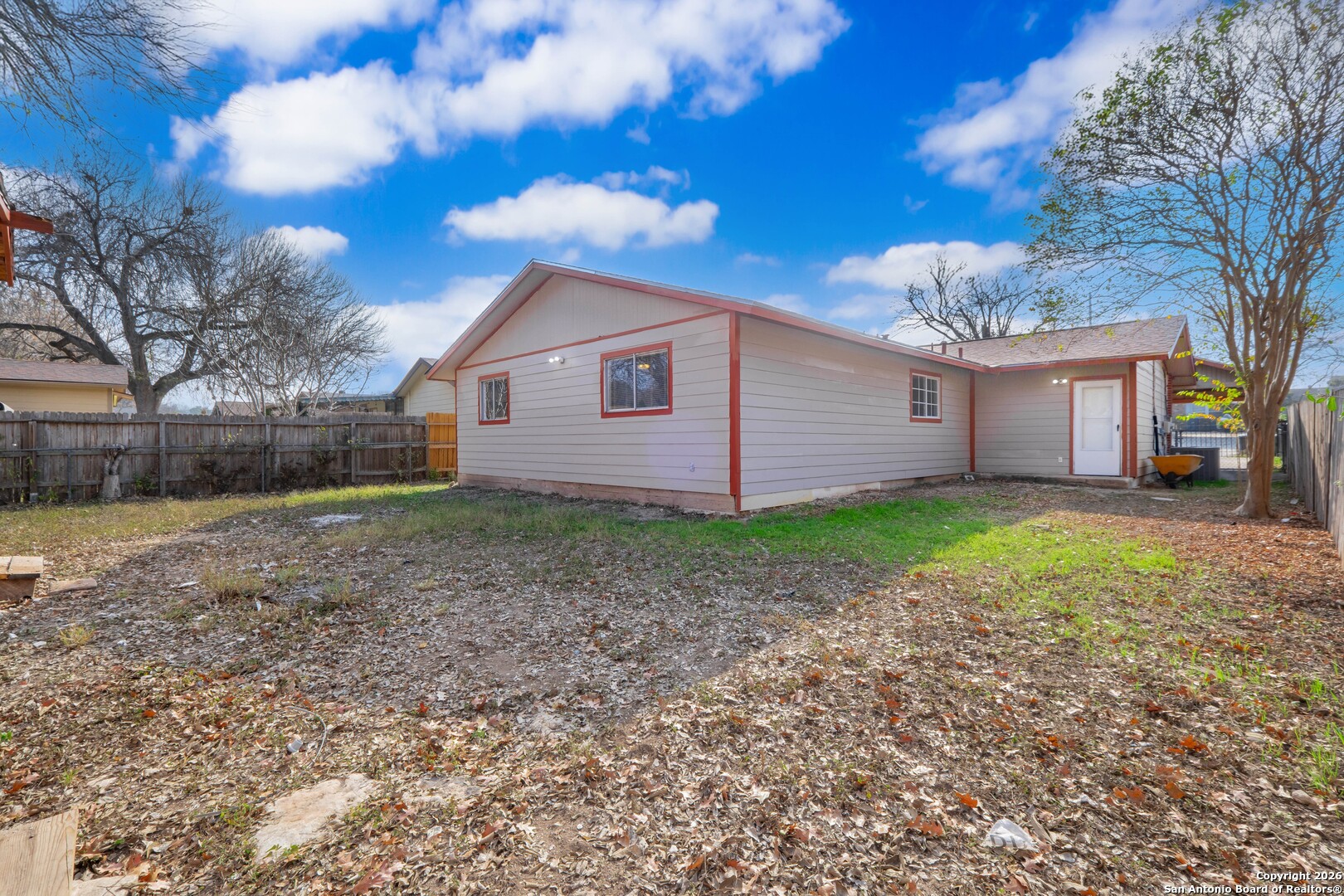5207 Overpool Street San Antonio, TX 78228 - Photo 25 of 31 a view of a house with a yard and large tree