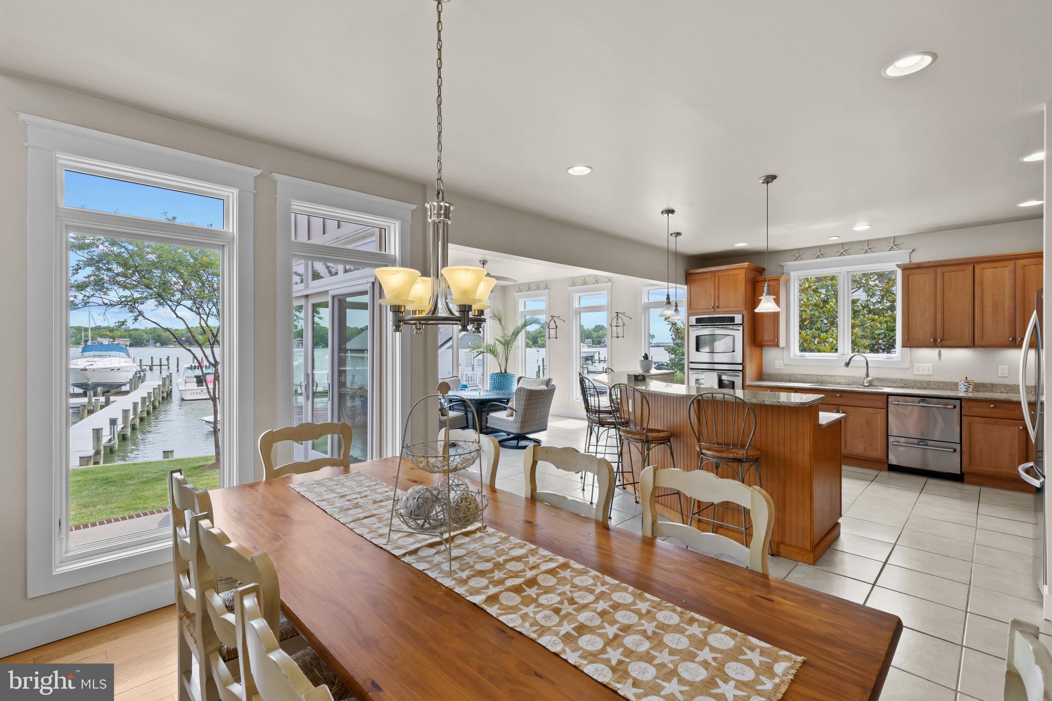 3733 Thomas Point Road Annapolis, MD 21403 - Photo 11 of 46 Dining area with kitchen and sunroom beyond