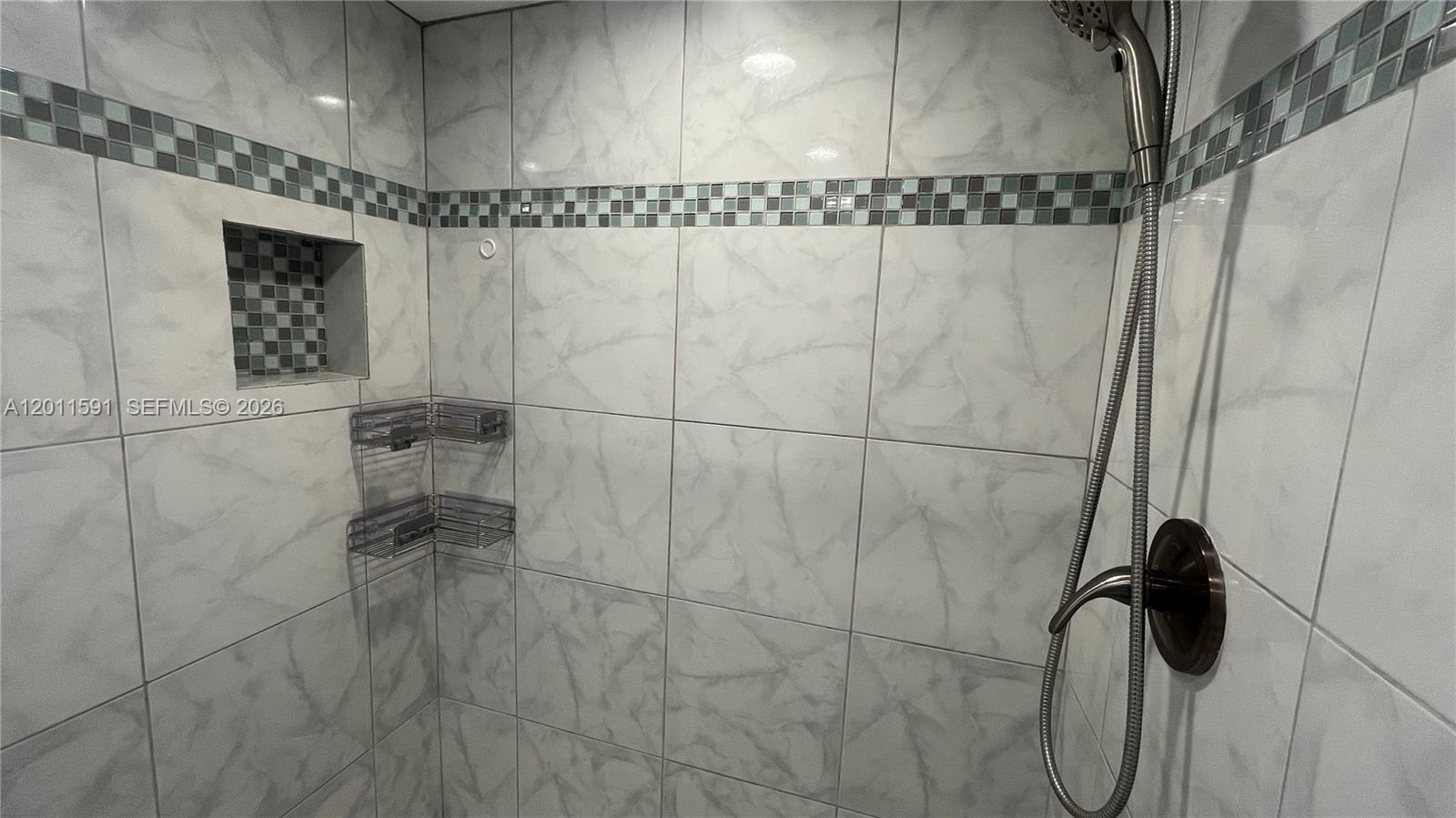 8540 Southwest 133rd Avenue Road, Unit 316 Miami, FL 33183 - Photo 12 of 18 a bathroom with a shower