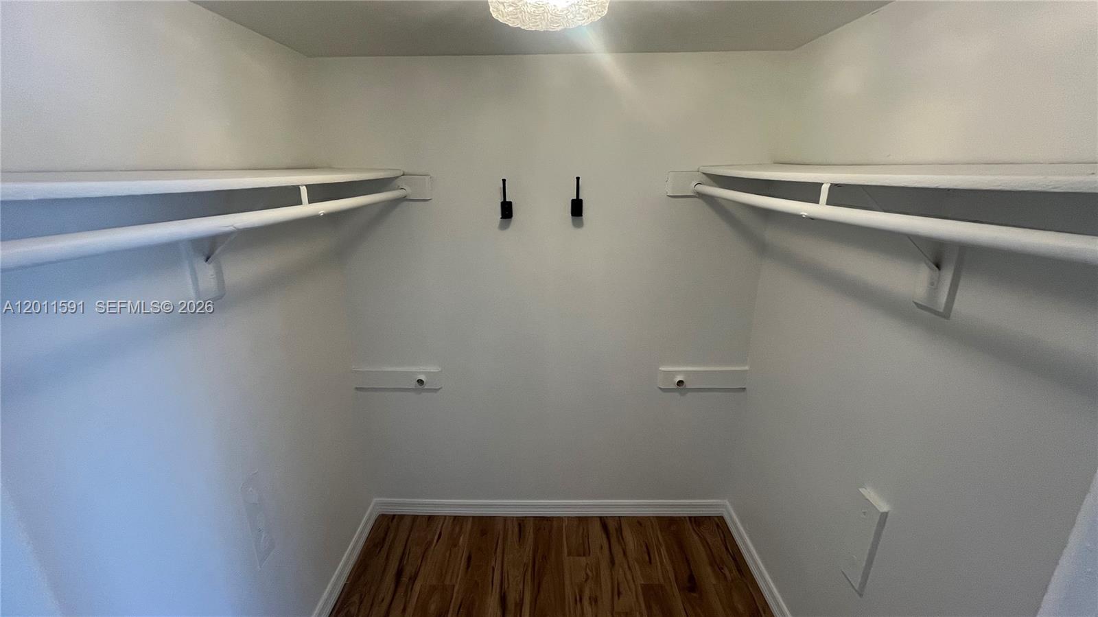 8540 Southwest 133rd Avenue Road, Unit 316 Miami, FL 33183 - Photo 14 of 18 a view of small space with racks on the wall