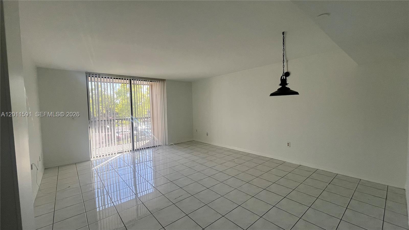 8540 Southwest 133rd Avenue Road, Unit 316 Miami, FL 33183 - Photo 6 of 18 an empty room with windows