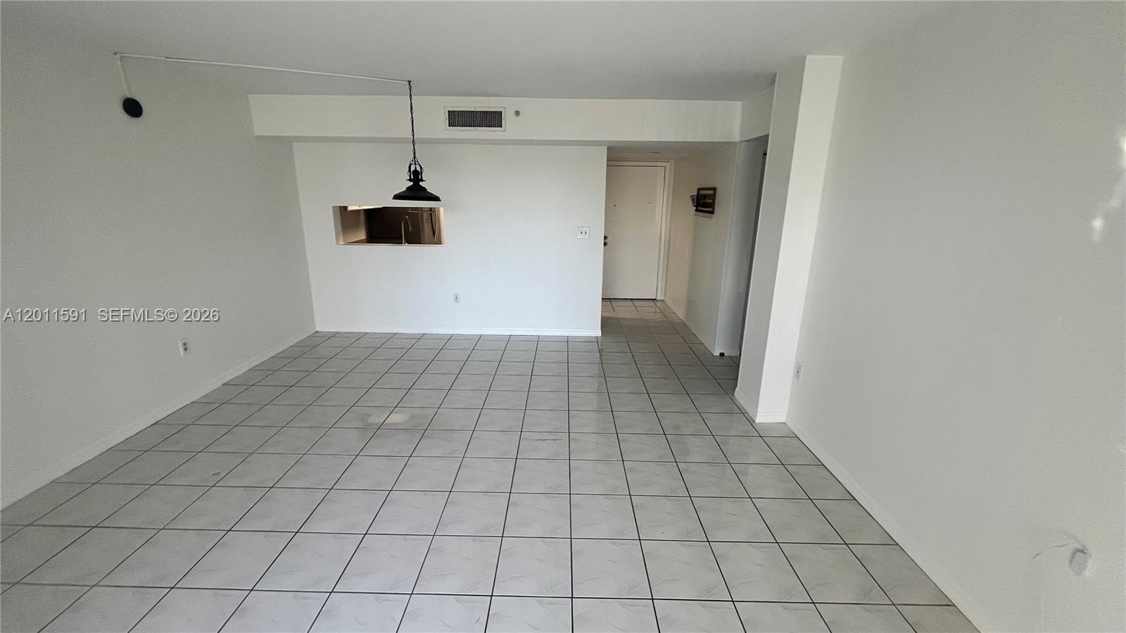 8540 Southwest 133rd Avenue Road, Unit 316 Miami, FL 33183 - Photo 7 of 18 a view of a livingroom with an empty space and a window
