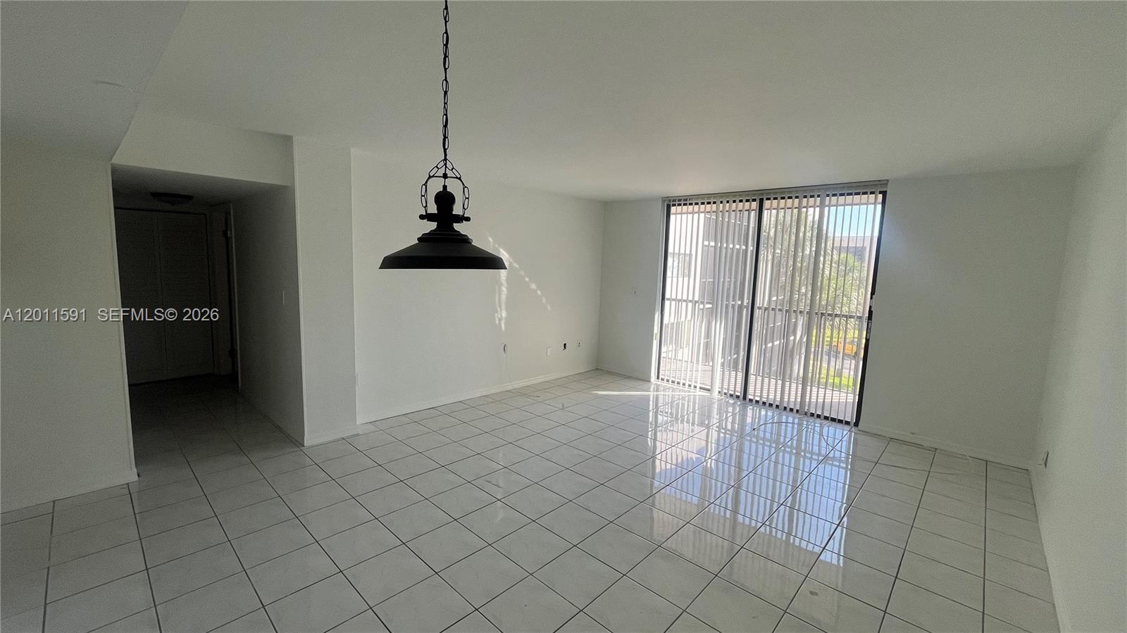 8540 Southwest 133rd Avenue Road, Unit 316 Miami, FL 33183 - Photo 8 of 18 a view of an empty room and window