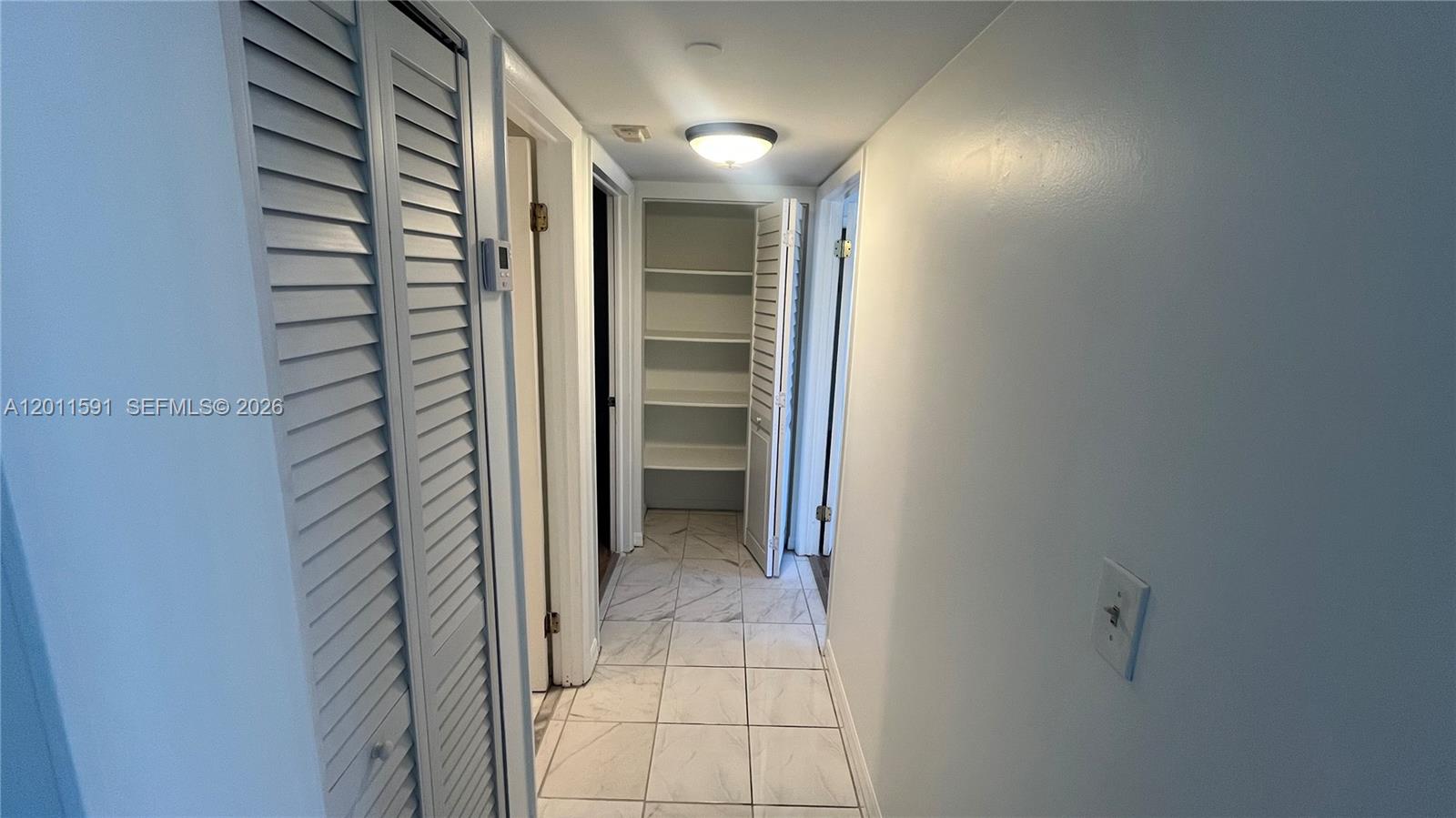 8540 Southwest 133rd Avenue Road, Unit 316 Miami, FL 33183 - Photo 9 of 18 a view of a hallway