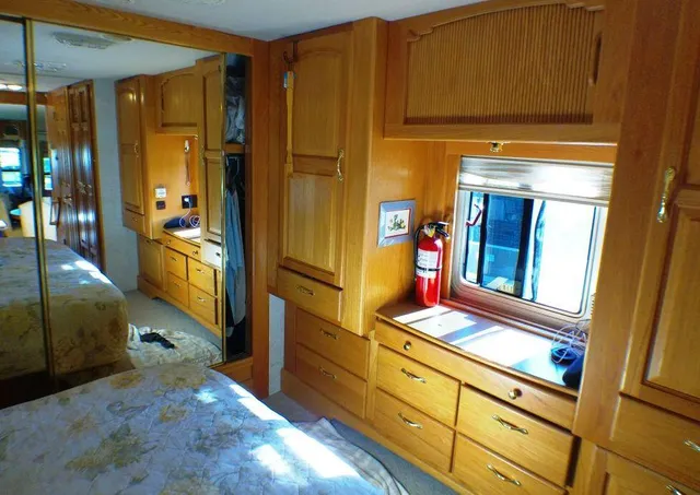 a hallway with wooden floor and furniture