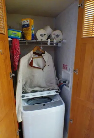 a bathroom with a toilet a sink and a window