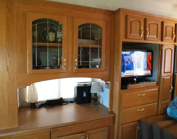a living room with furniture and a lamp