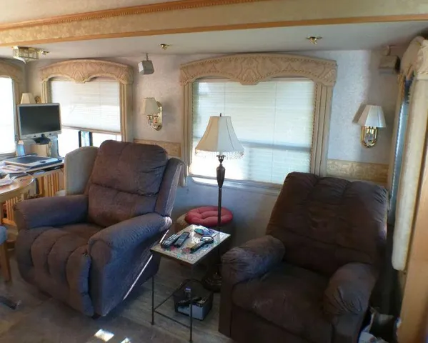 a living room with furniture and a lamp