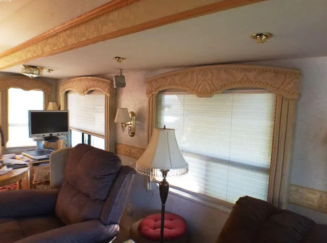 a kitchen view with cabinets a sink and appliances