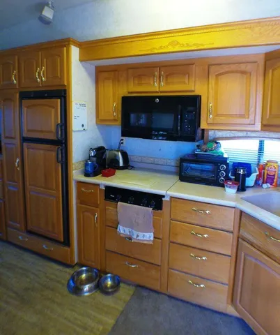 a kitchen with a refrigerator and a counter top