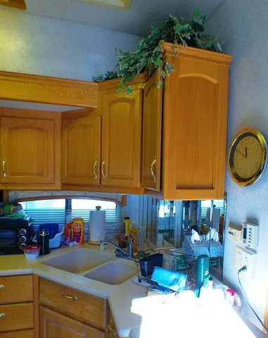 a living room with furniture and a lamp