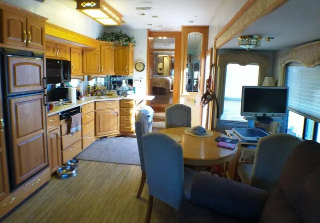 a kitchen with a sink a stove and cabinets