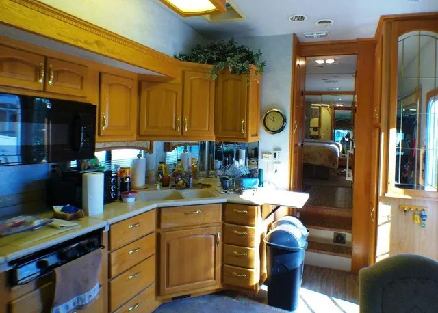 a living room with furniture and a mirror