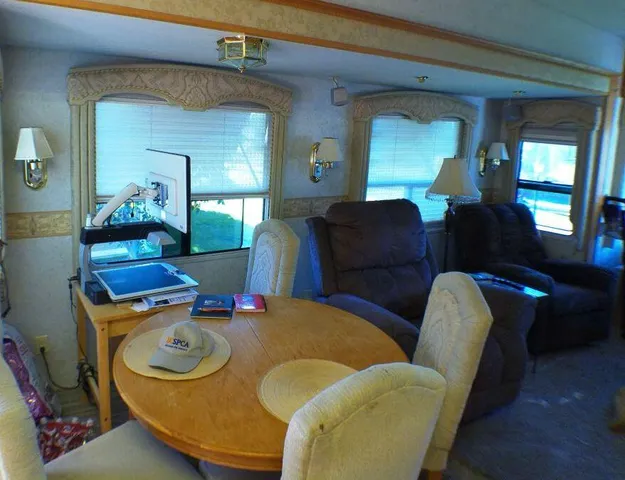 a front view of a house with a yard table and chairs