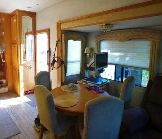 a view of a house with swimming pool and a yard