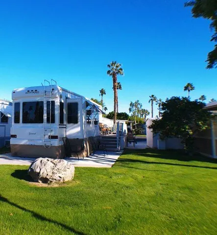 a view of a house with a yard porch and sitting area
