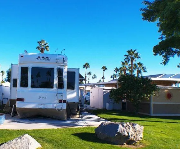 a view of a house with a yard porch and sitting area