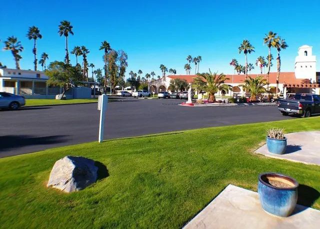 a view of house with a yard