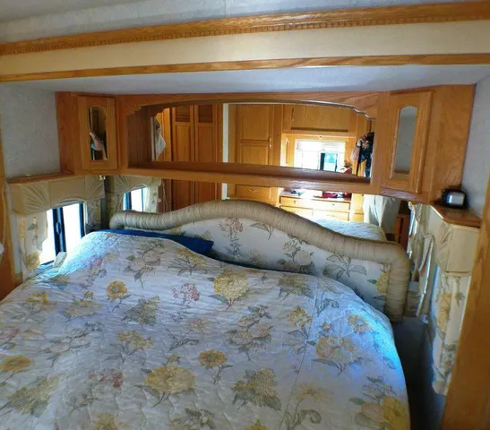 a view of a bedroom with furniture and staircase