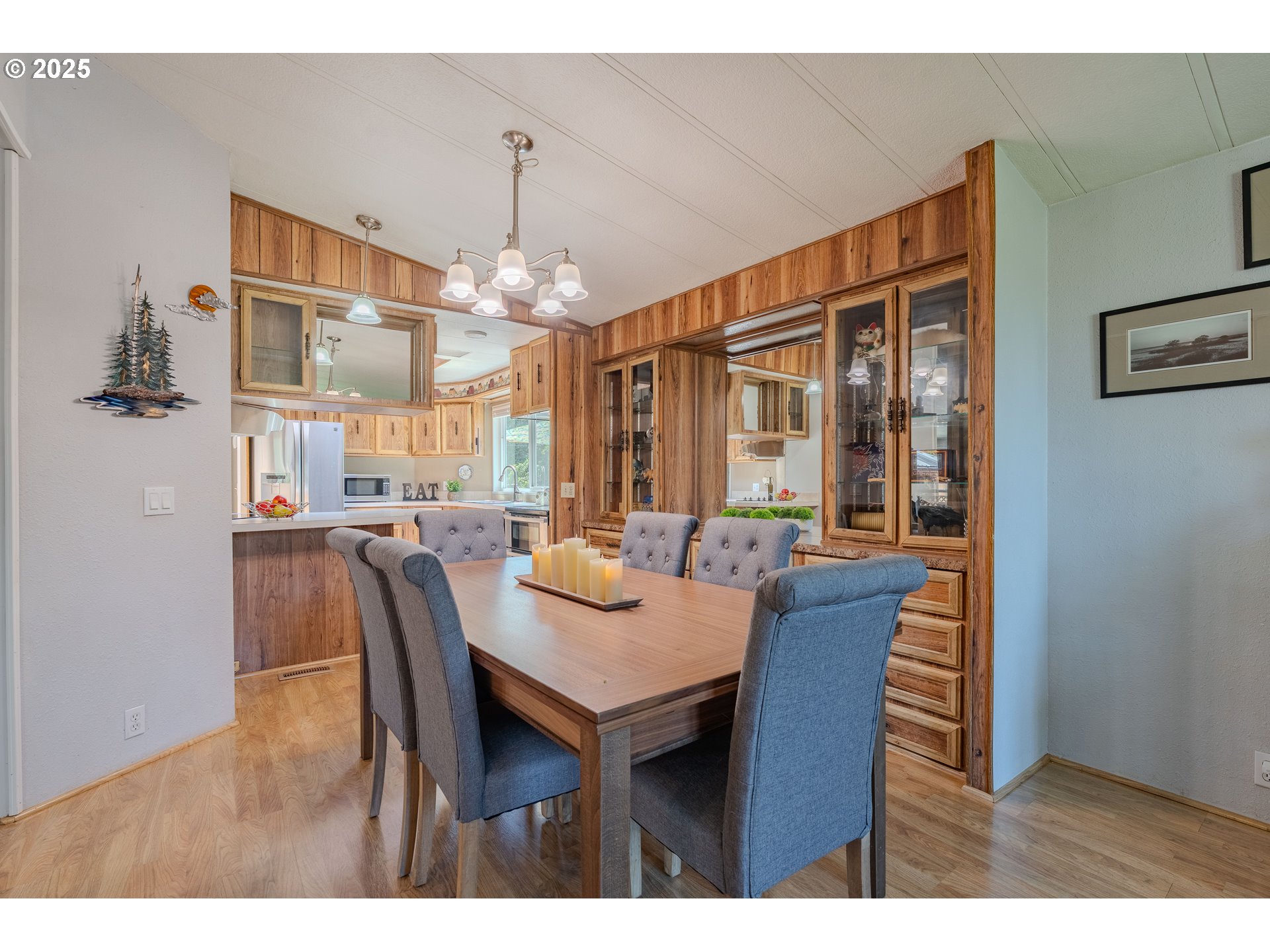 1317 Northeast 267th Avenue Camas, WA 98607 - Photo 12 of 43 a dining room with furniture a chandelier and wooden floor