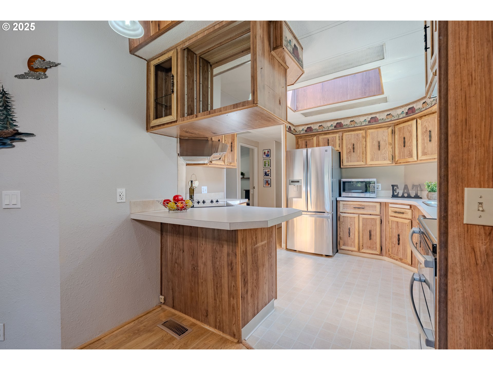 1317 Northeast 267th Avenue Camas, WA 98607 - Photo 13 of 43 a kitchen with kitchen island a sink appliances and cabinets