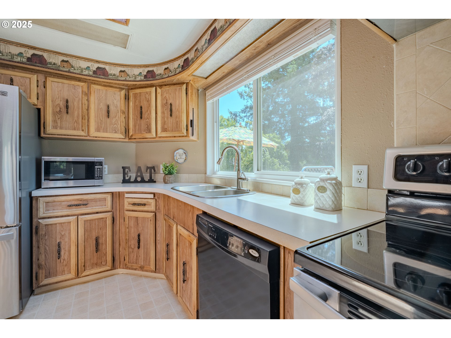 1317 Northeast 267th Avenue Camas, WA 98607 - Photo 14 of 43 a kitchen with stainless steel appliances granite countertop a sink and a stove