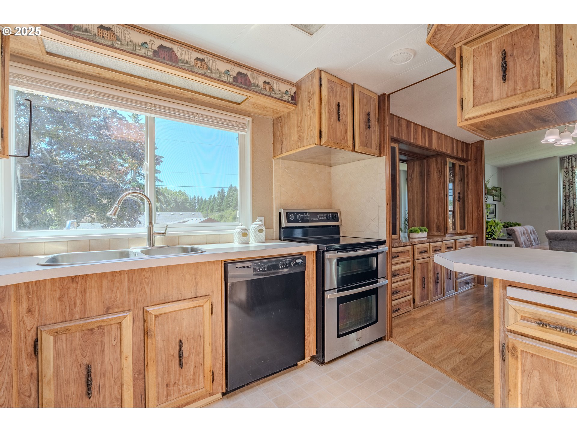 1317 Northeast 267th Avenue Camas, WA 98607 - Photo 17 of 43 a kitchen with stainless steel appliances granite countertop a stove and a sink