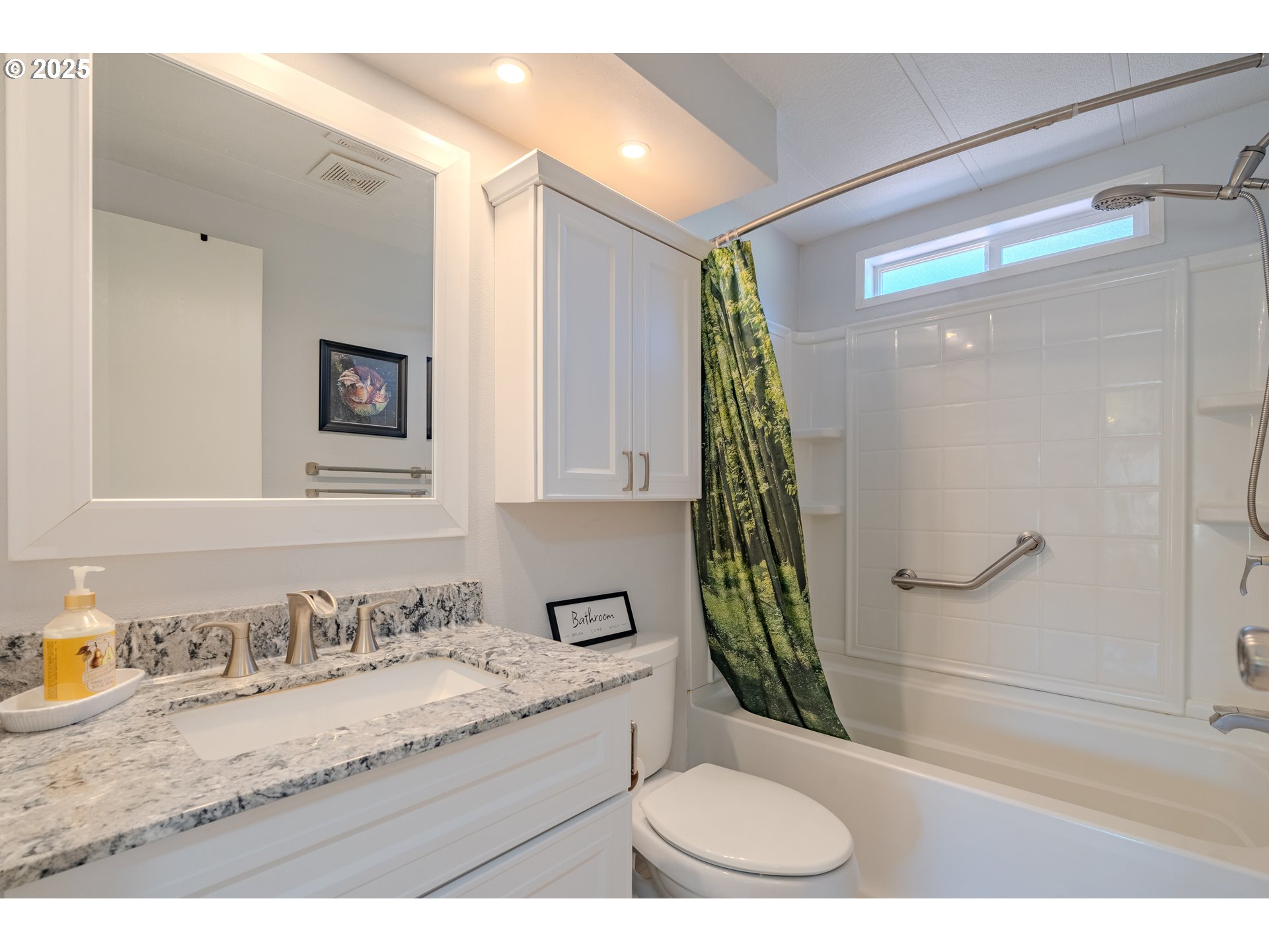 1317 Northeast 267th Avenue Camas, WA 98607 - Photo 21 of 43 a bathroom with a granite countertop sink a toilet a mirror and shower