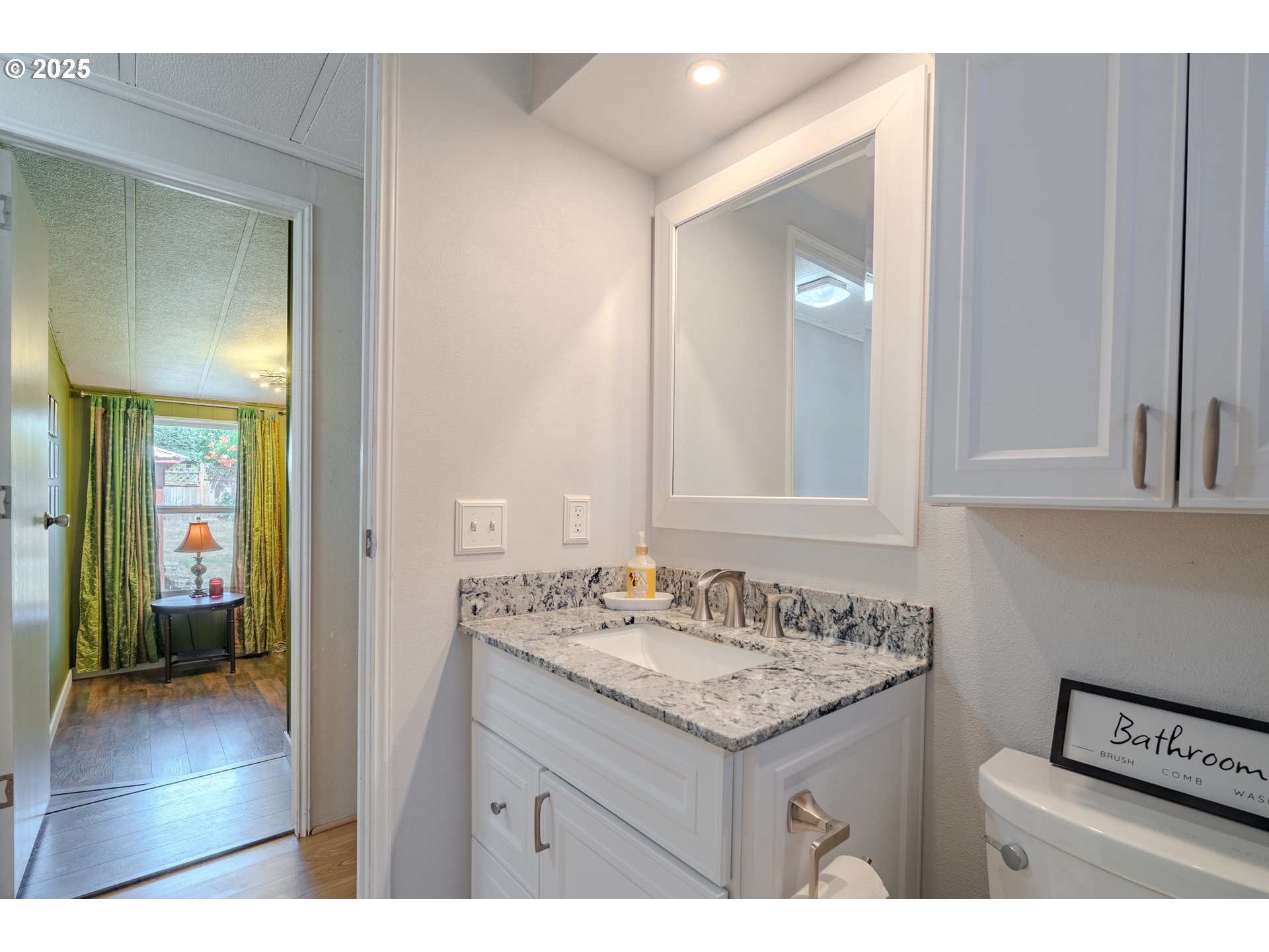 1317 Northeast 267th Avenue Camas, WA 98607 - Photo 22 of 43 a bathroom with a sink vanity and a mirror