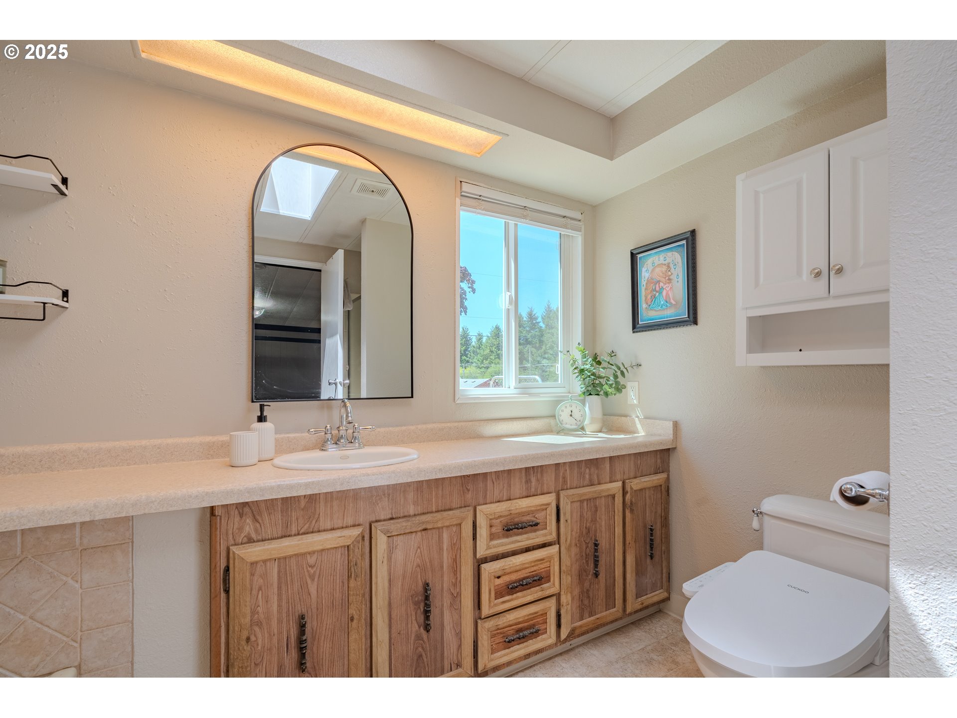 1317 Northeast 267th Avenue Camas, WA 98607 - Photo 27 of 43 a bathroom with a granite countertop sink a mirror and a toilet