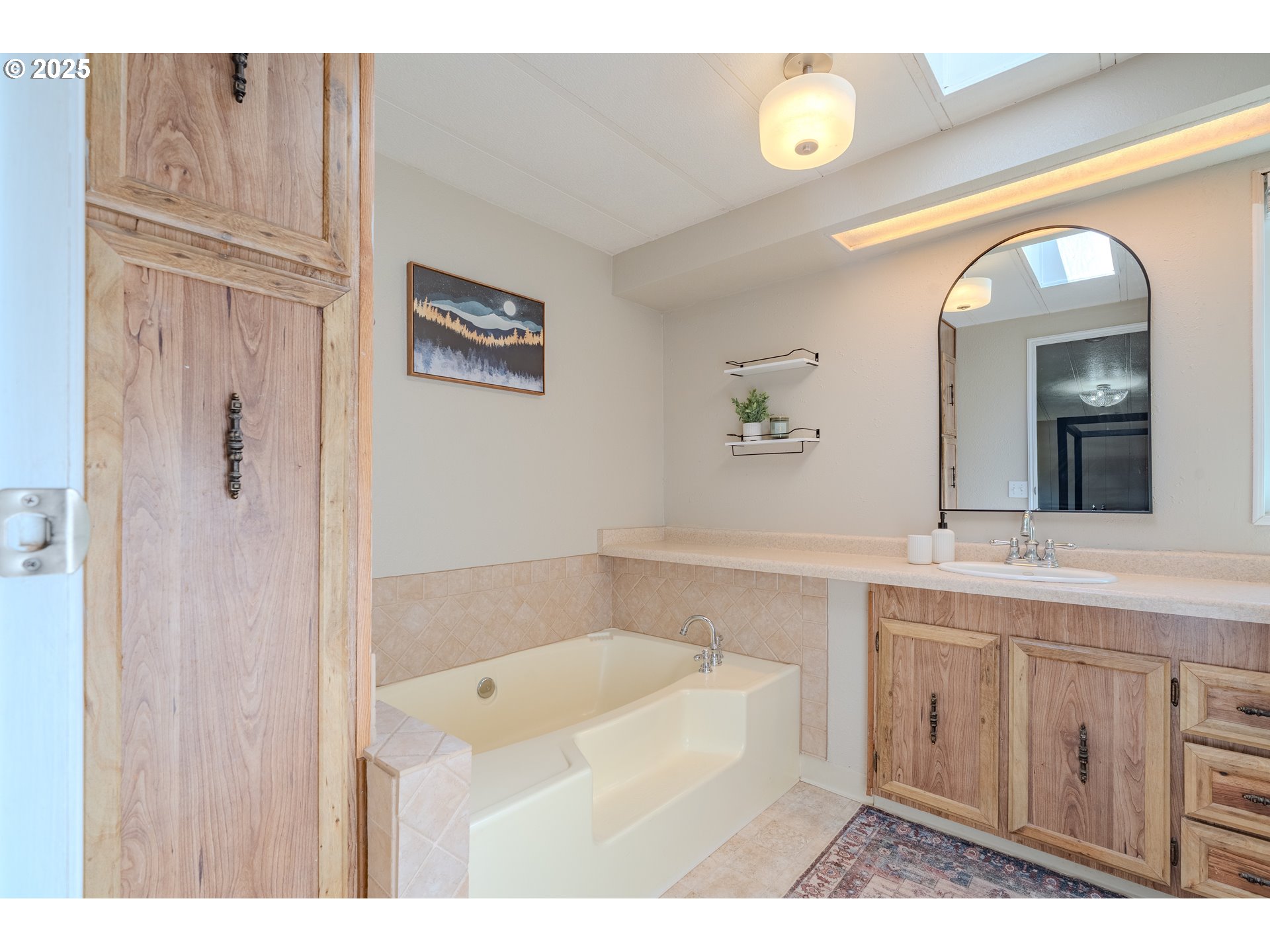 1317 Northeast 267th Avenue Camas, WA 98607 - Photo 29 of 43 a spacious bathroom with a tub sink and mirror