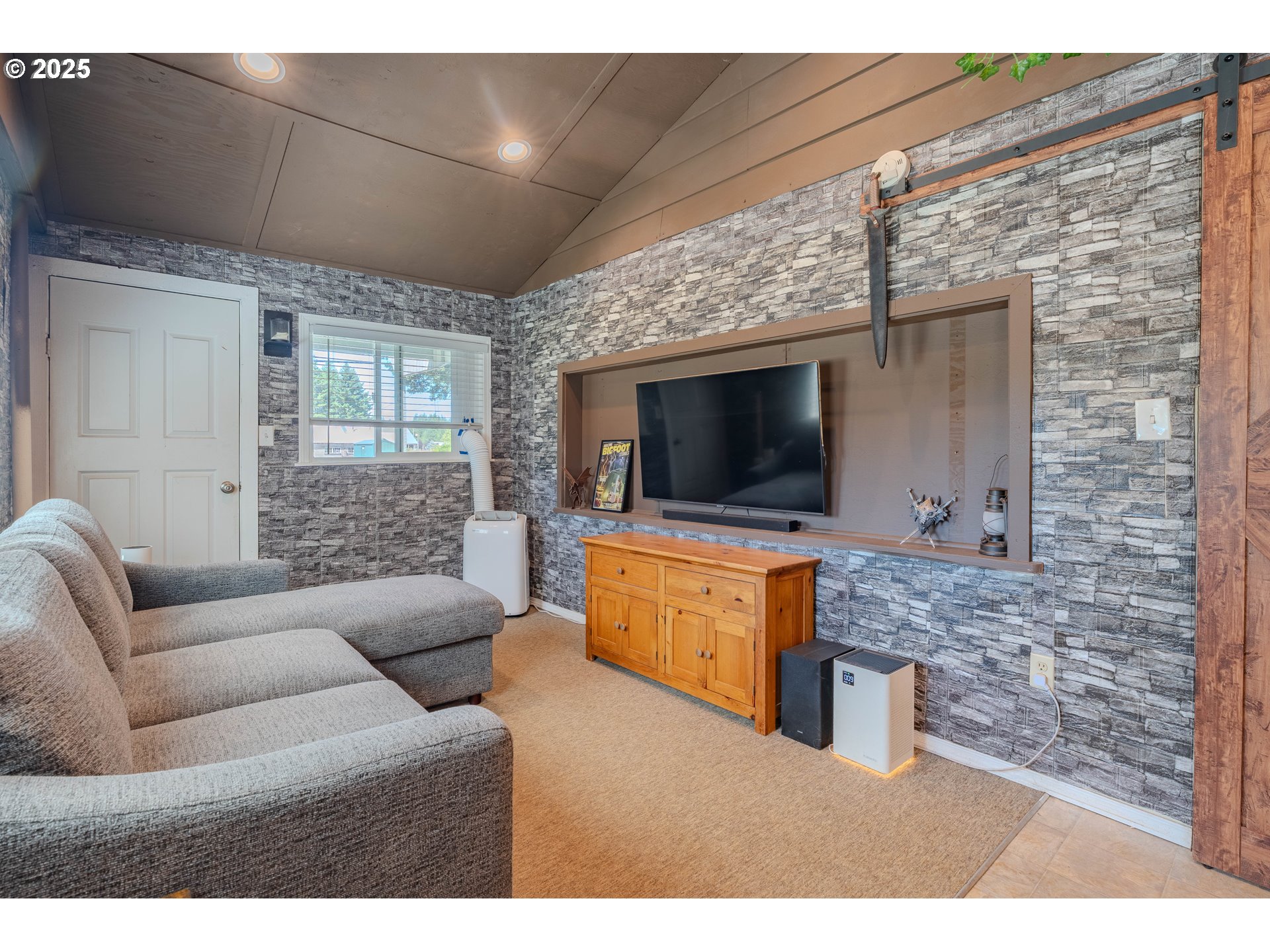 1317 Northeast 267th Avenue Camas, WA 98607 - Photo 31 of 43 a living room with furniture and a flat screen tv