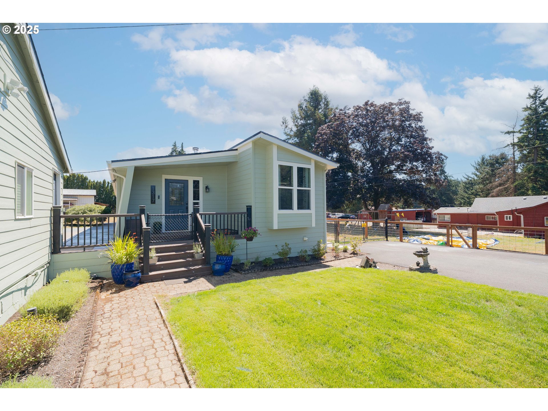 1317 Northeast 267th Avenue Camas, WA 98607 - Photo 4 of 43 a swimming pool with outdoor seating yard and furniture