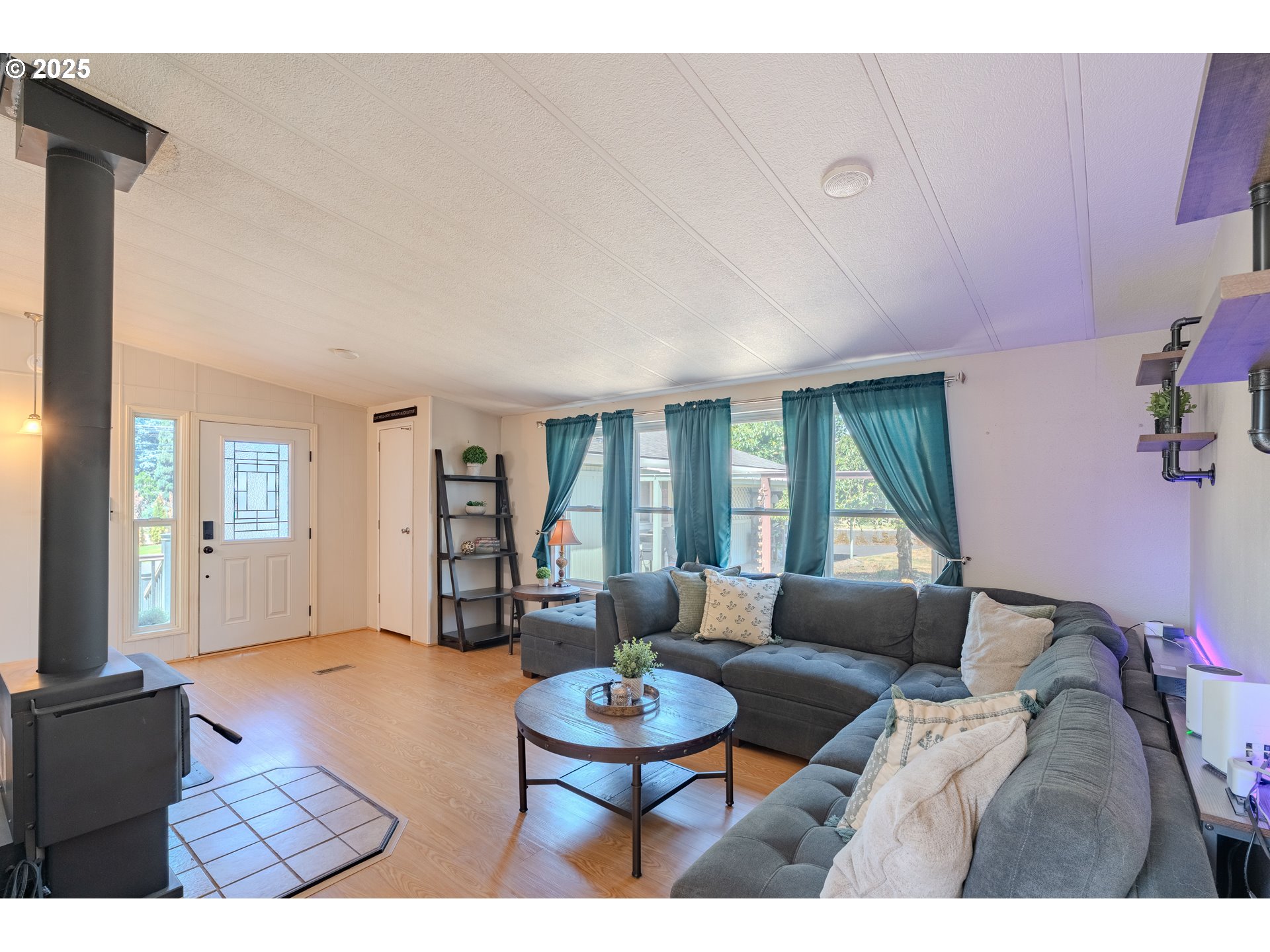 1317 Northeast 267th Avenue Camas, WA 98607 - Photo 8 of 43 a living room with furniture and a large window