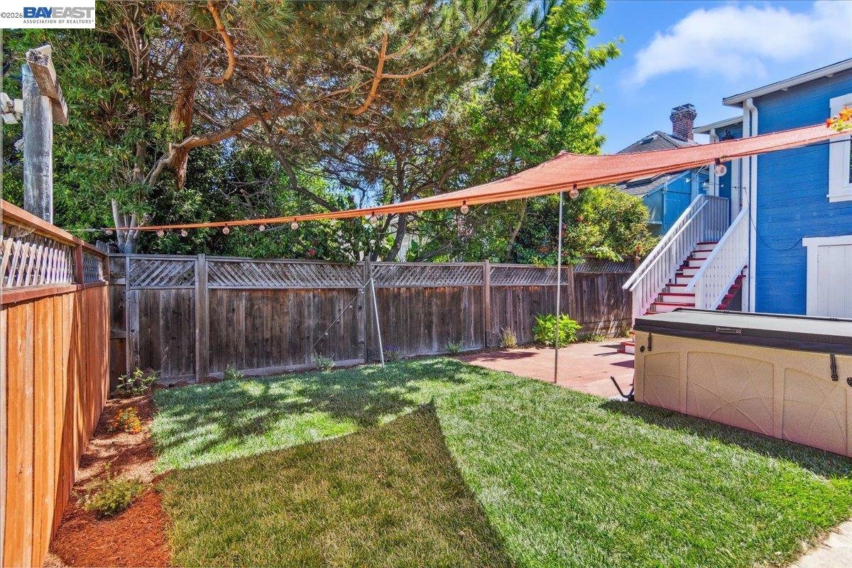 1813 Minturn Street Alameda, CA 94501 - Photo 26 of 29 a view of a backyard with wooden fence and a bench