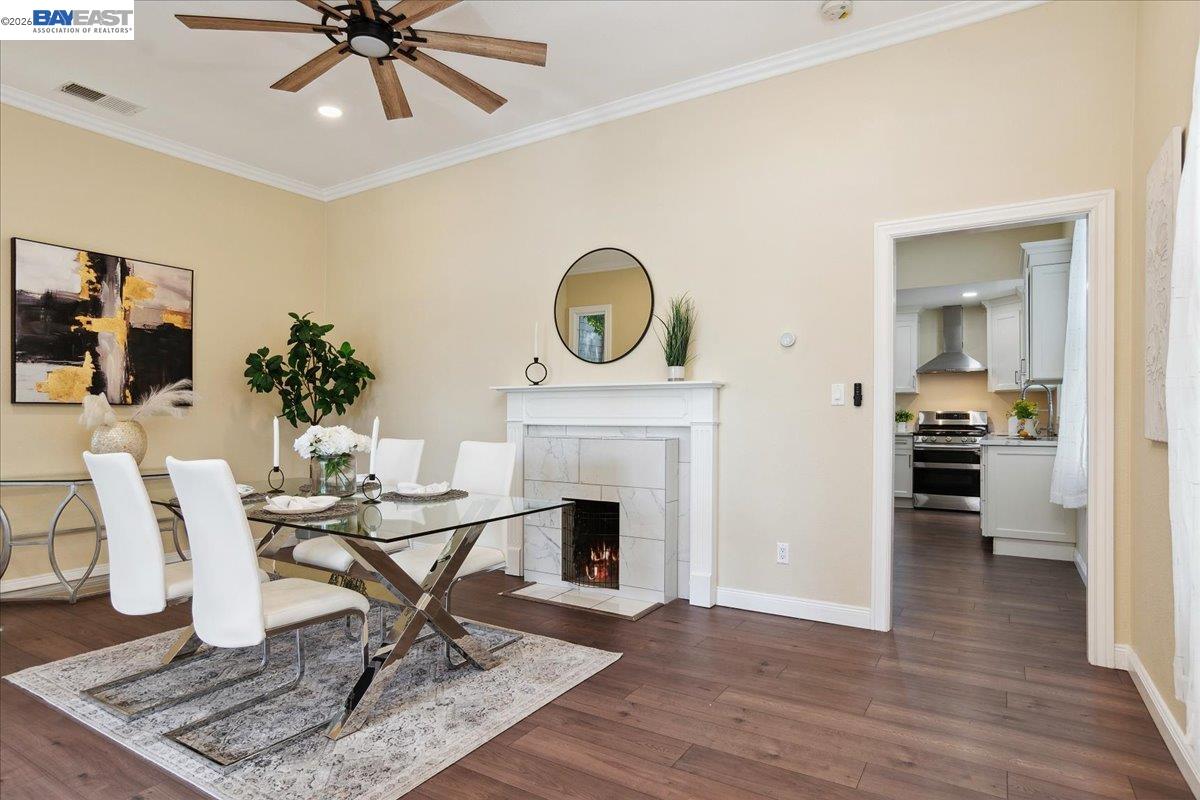 1813 Minturn Street Alameda, CA 94501 - Photo 6 of 29 a living room with furniture a fireplace and a chandelier