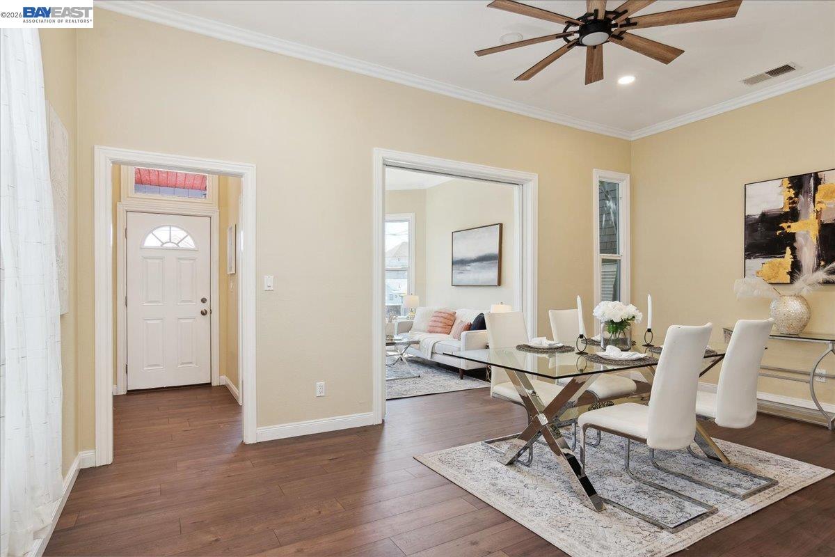 1813 Minturn Street Alameda, CA 94501 - Photo 8 of 29 a workspace with wooden floor and a chandelier fan