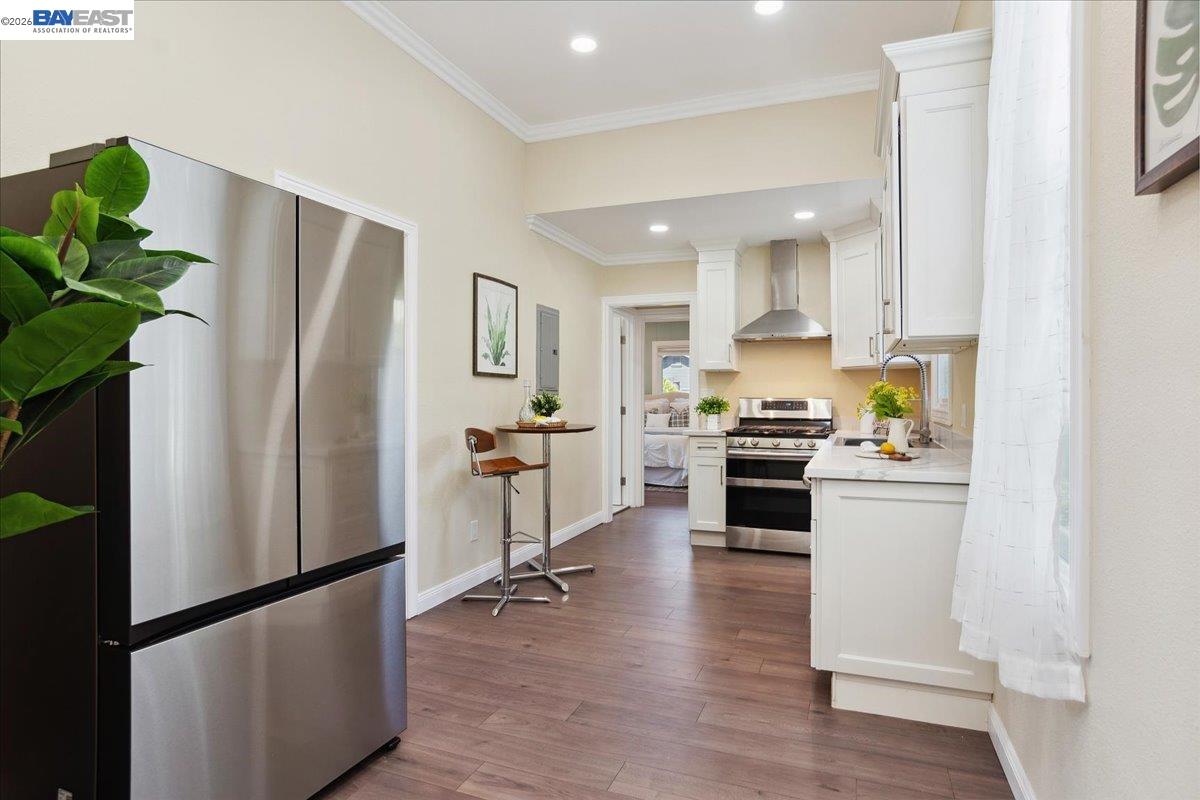1813 Minturn Street Alameda, CA 94501 - Photo 9 of 29 a kitchen with stainless steel appliances a refrigerator sink and white cabinets