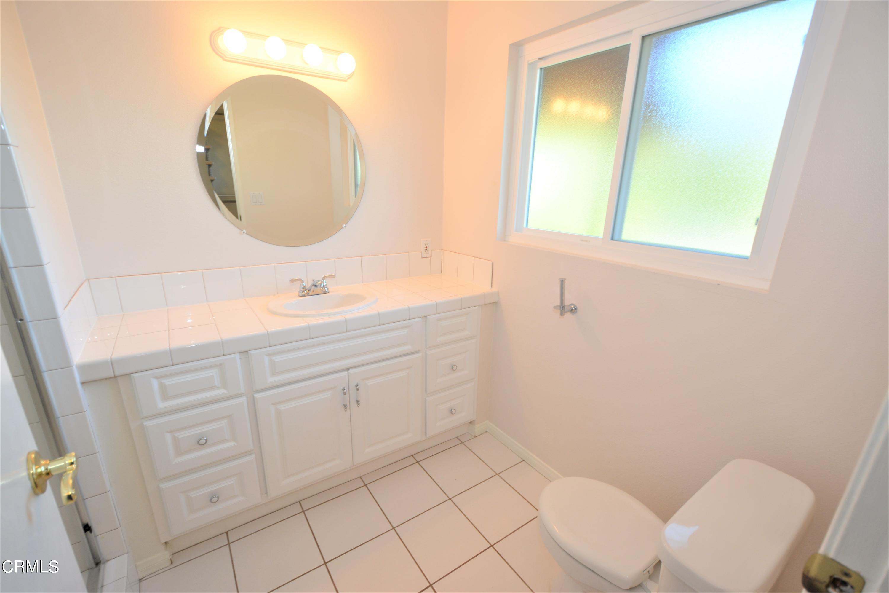 3252 Radcliffe Road Thousand Oaks, CA 91360 - Photo 23 of 31 a bathroom with a sink mirror vanity and toilet