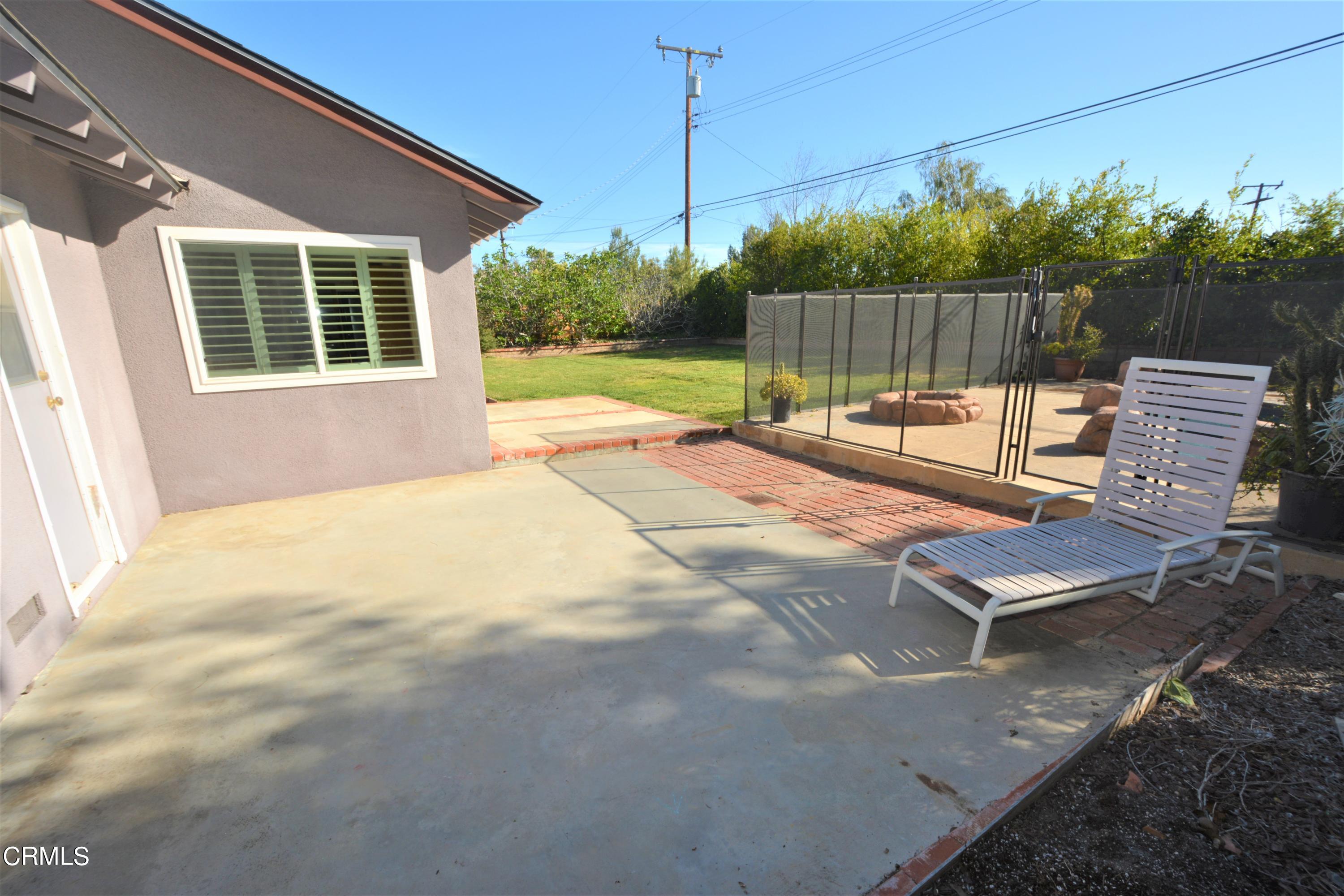 3252 Radcliffe Road Thousand Oaks, CA 91360 - Photo 28 of 31 a view of a backyard with couches and wooden fence