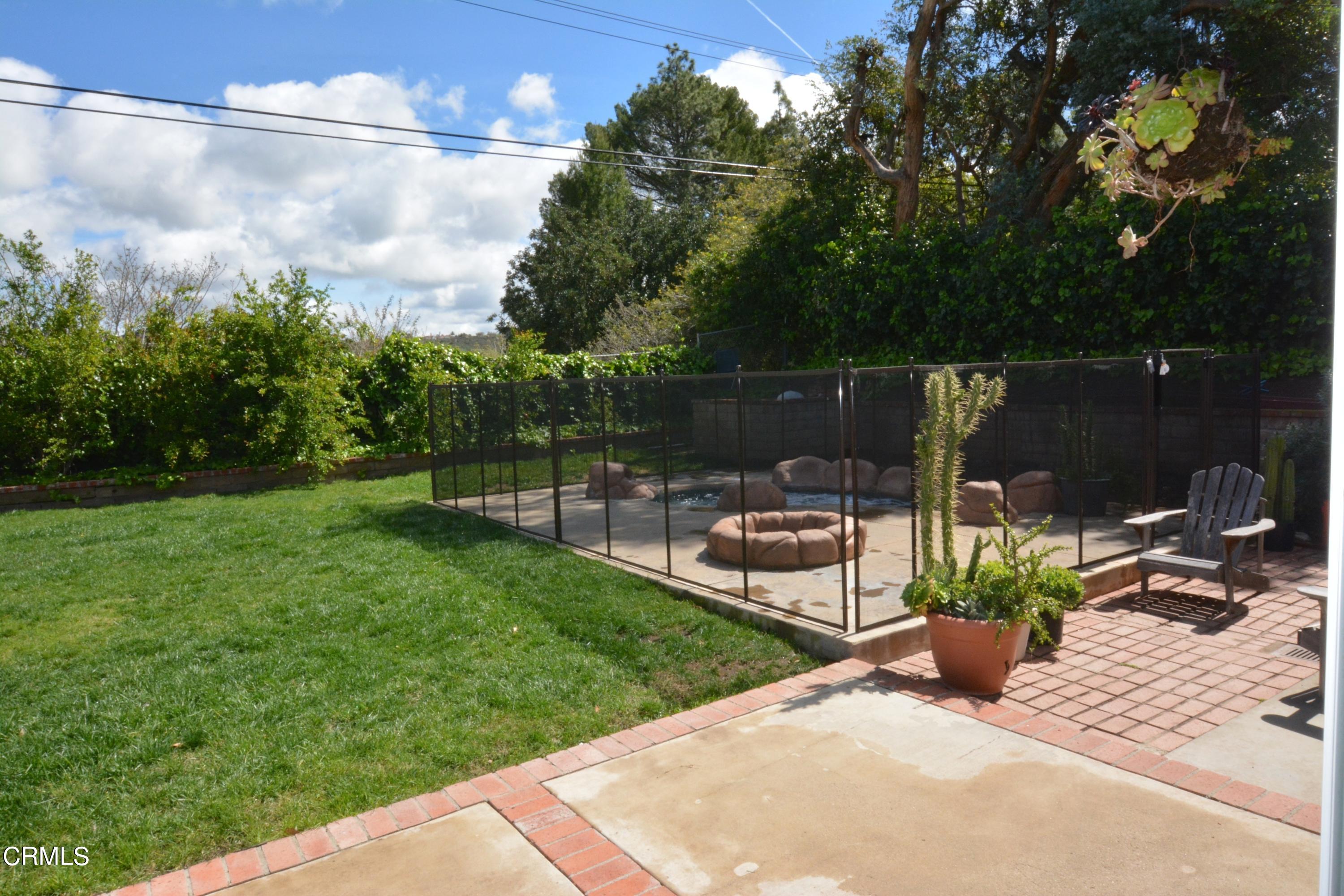 3252 Radcliffe Road Thousand Oaks, CA 91360 - Photo 29 of 31 a view of a bench in the garden near a lake