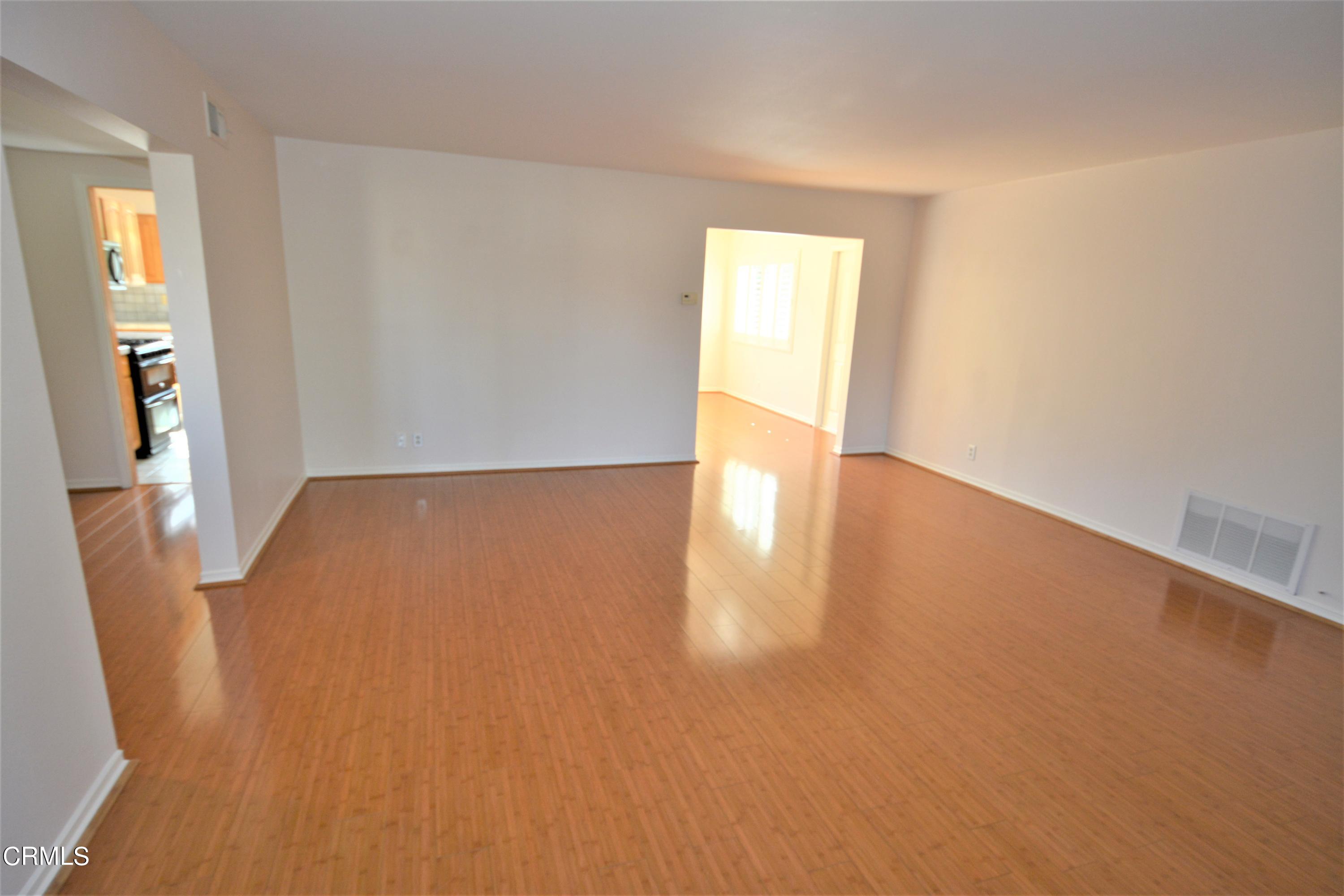 3252 Radcliffe Road Thousand Oaks, CA 91360 - Photo 6 of 31 a view of an empty room with wooden floor and a window