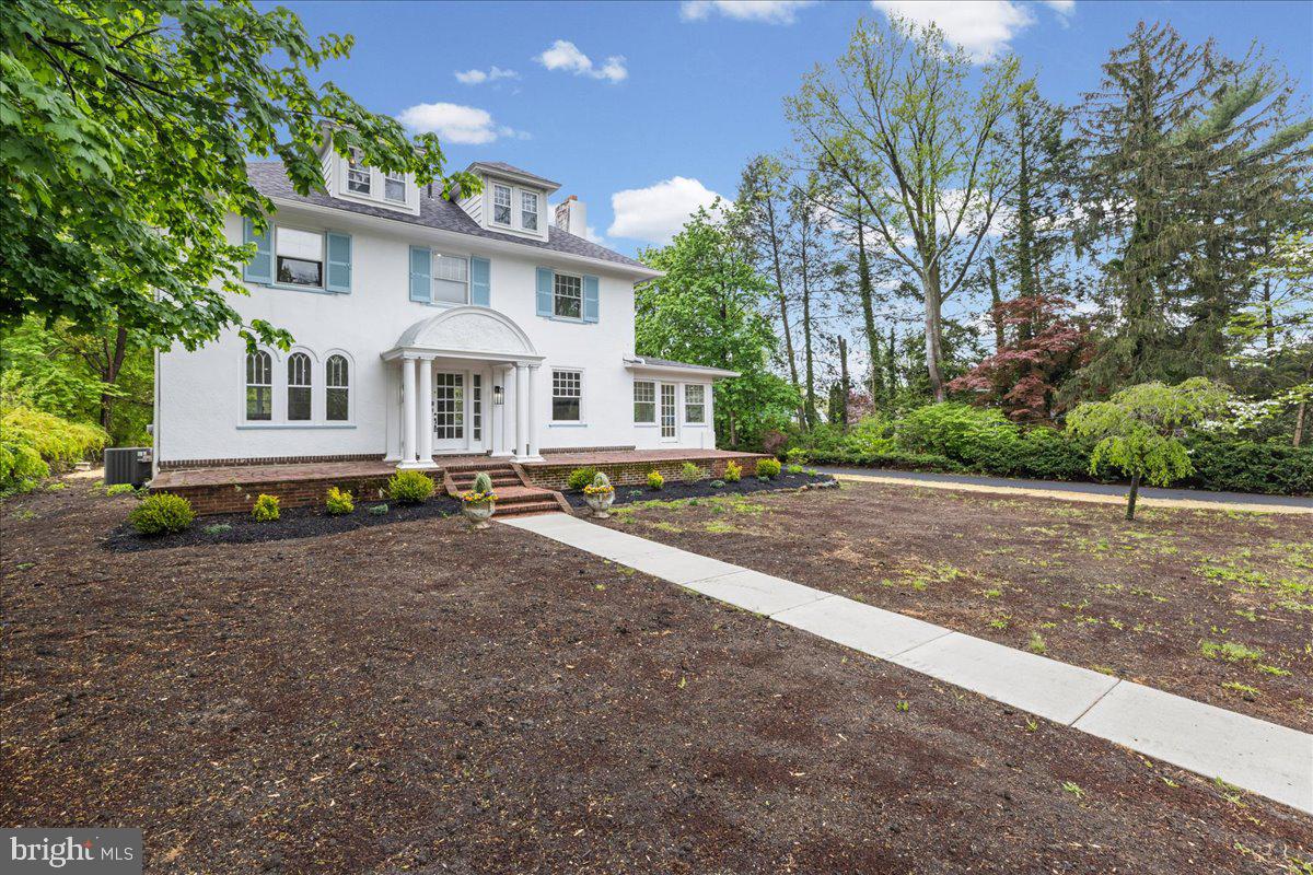 215 Browning Road Merchantville, NJ 08109 - Photo 4 of 55 Charming white home with lush greenery.
