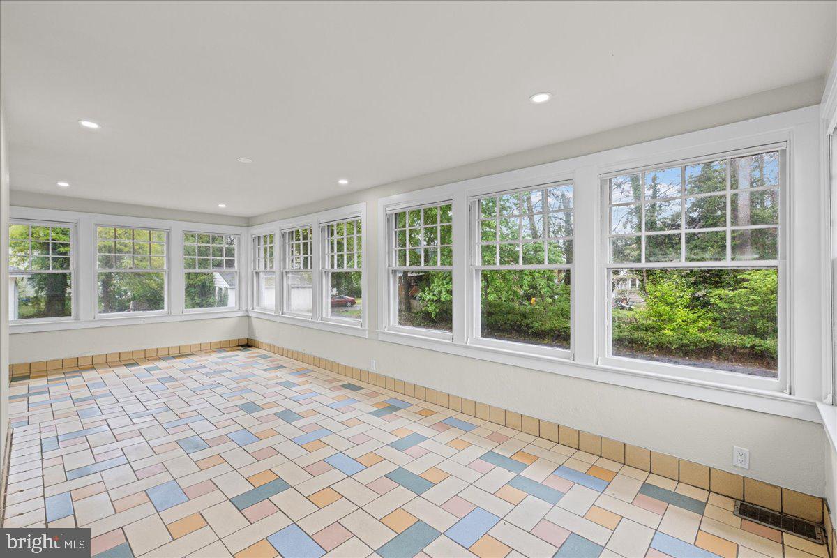 215 Browning Road Merchantville, NJ 08109 - Photo 6 of 55 Bright sunroom with vibrant tile floor.
