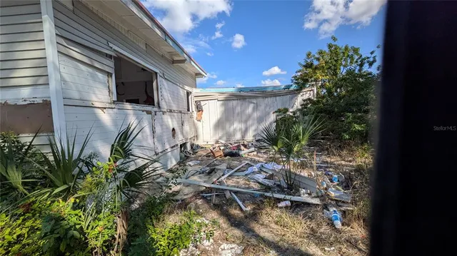 a big yard with lots of green space and trees