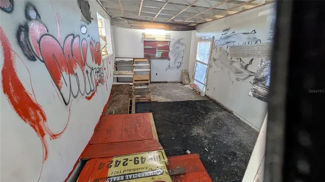 a view of a hallway with a tv