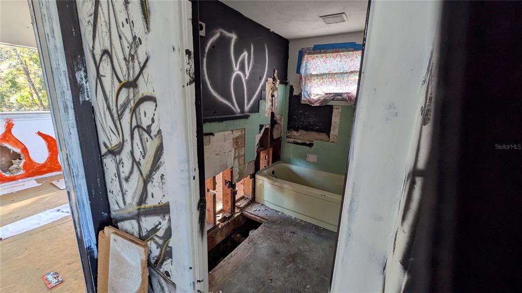 16836 Highway 19 Hudson, FL 34667 - Photo 9 of 16 a view of walk in closet with clothes and shoes